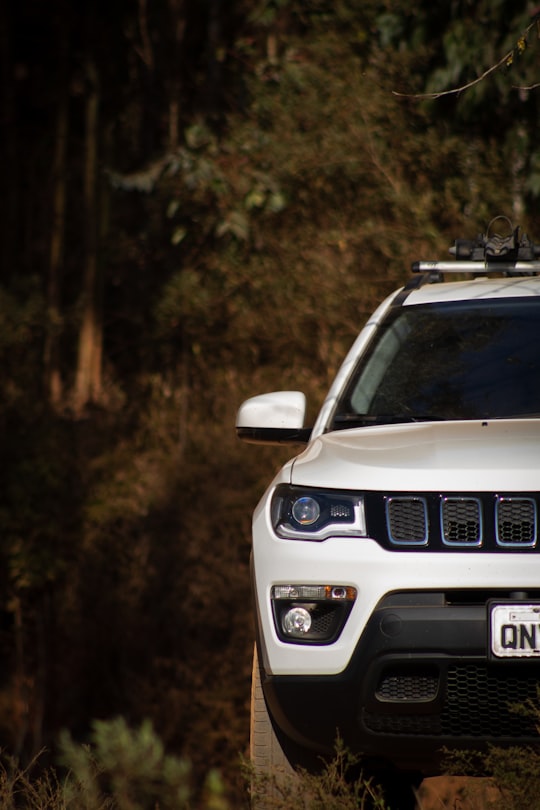 white ford mustang on road during daytime in Passa Quatro Brasil