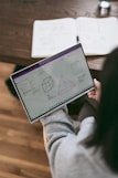 person holding tablet 