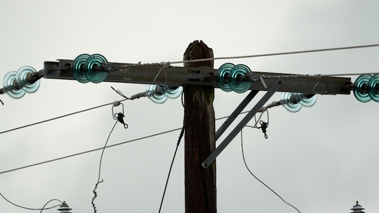 Close-up of a porcelain electrical insulator with a smooth, glossy finish highlighting its durability.