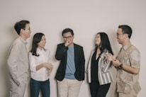 A diverse group of individuals engaged in conversation, representing the importance of communication and human connections.