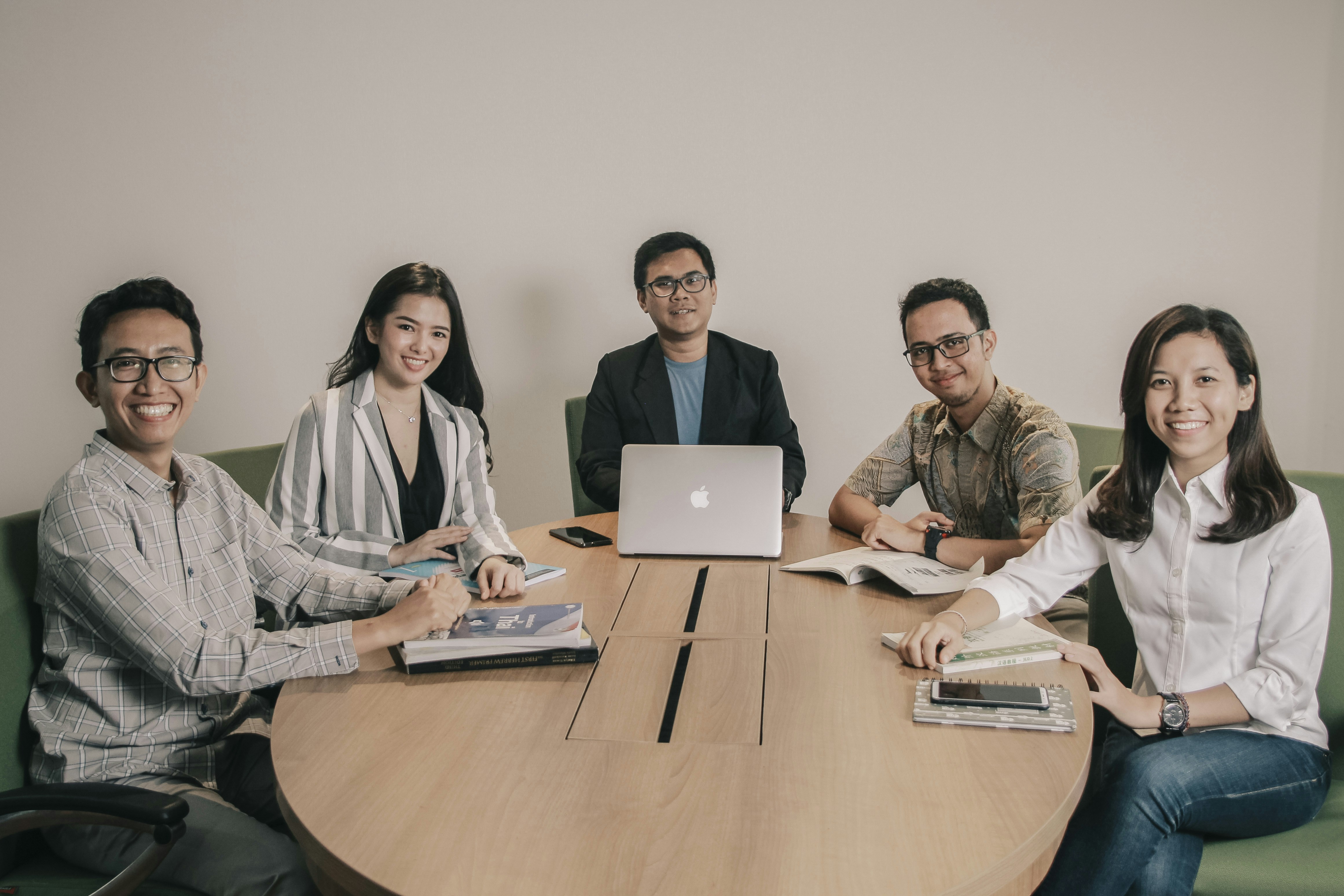 Professional accounting team collaborating on financial strategies in a modern meeting room
