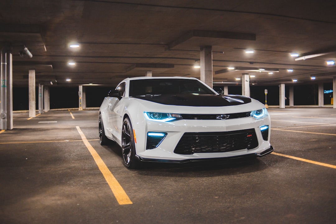 white and blue bmw m 3 coupe parked on parking lot