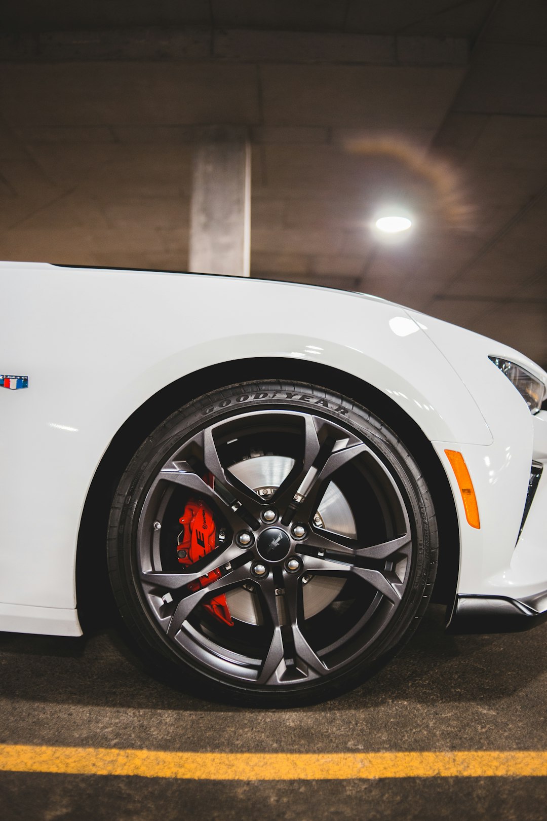 white car with black wheel