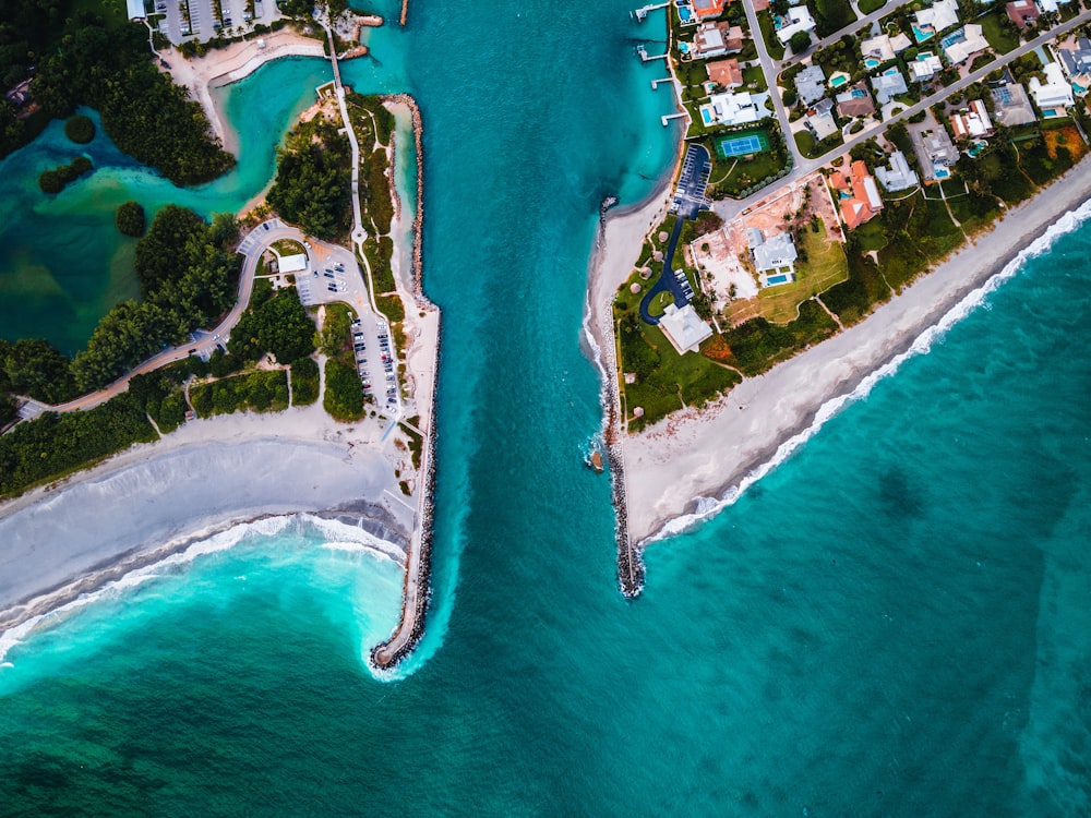 aerial view of city buildings near body of water during daytime