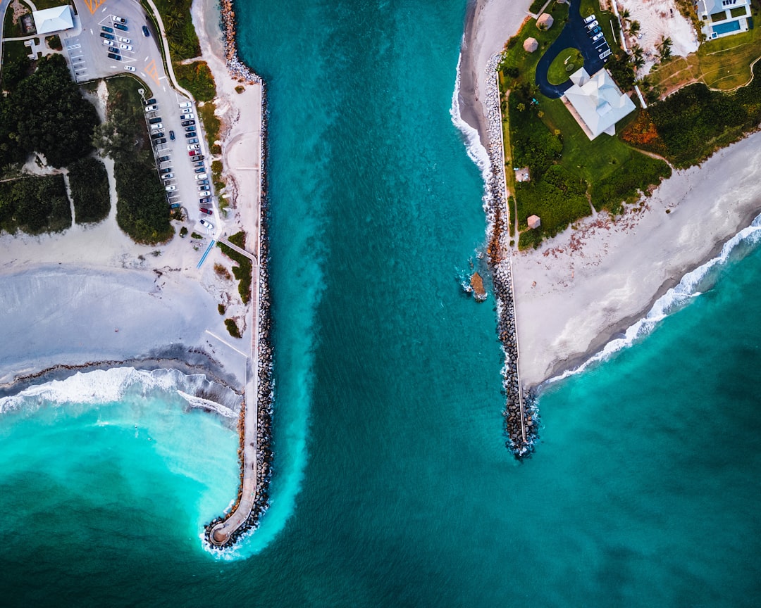 Jupiter inlet Birdseye view, blue sea and white beach – customer acquisition - Photo from Unsplash | best digital marketing - London, Bristol and Bath marketing agency