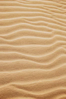 brown sand with shadow of person