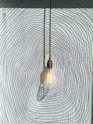 clear glass pendant lamp turned off