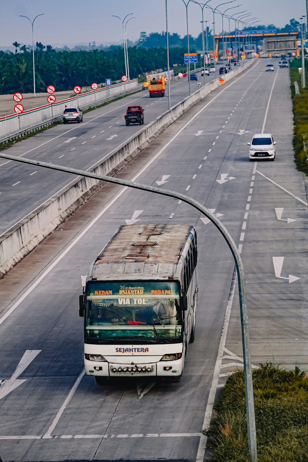 white and black bus on road during daytime