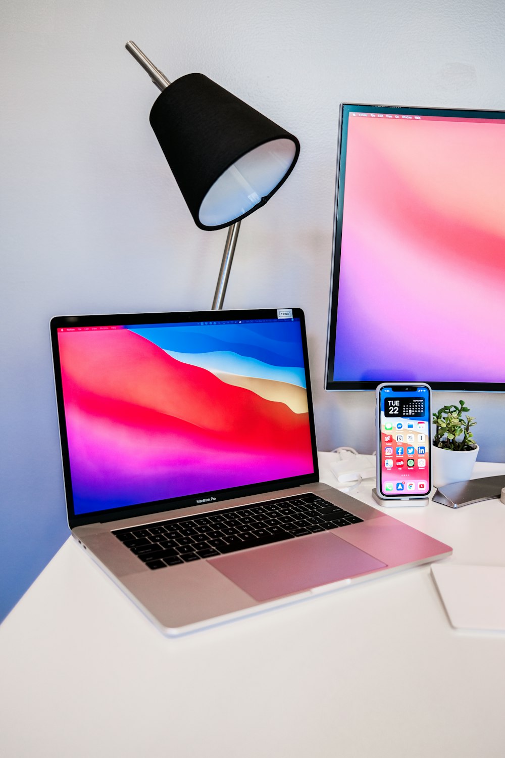 macbook pro on white table