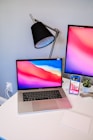 macbook pro on white table