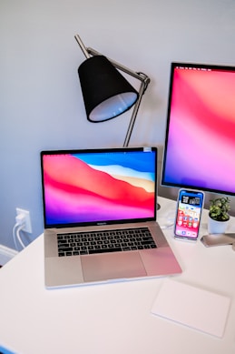 macbook pro on white table