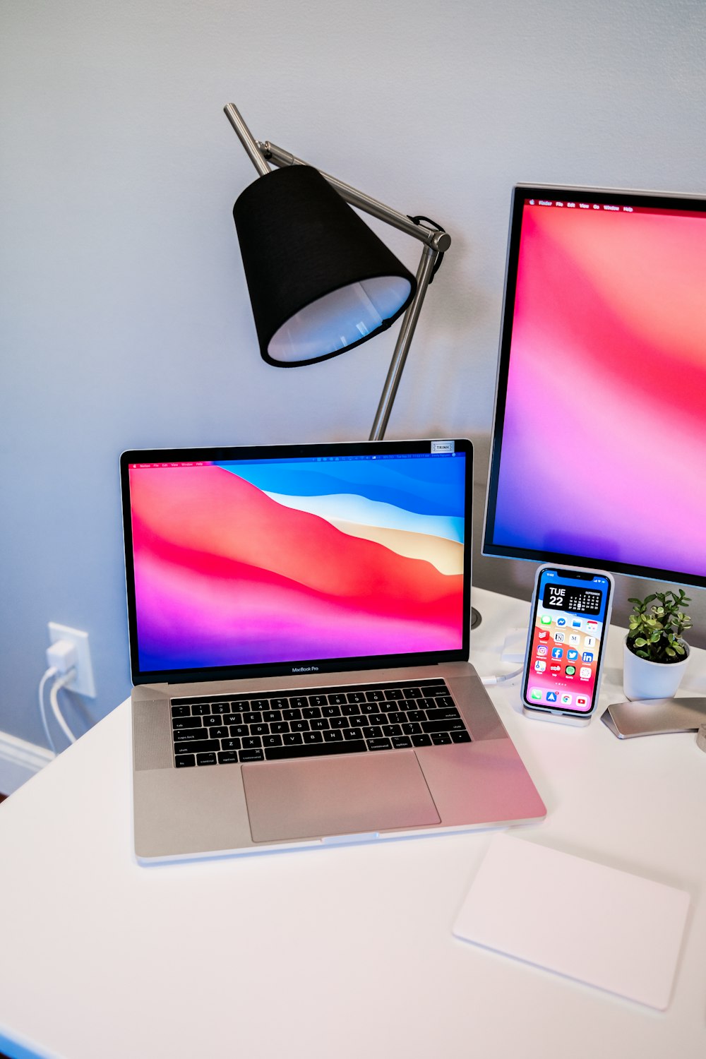 macbook pro on white table