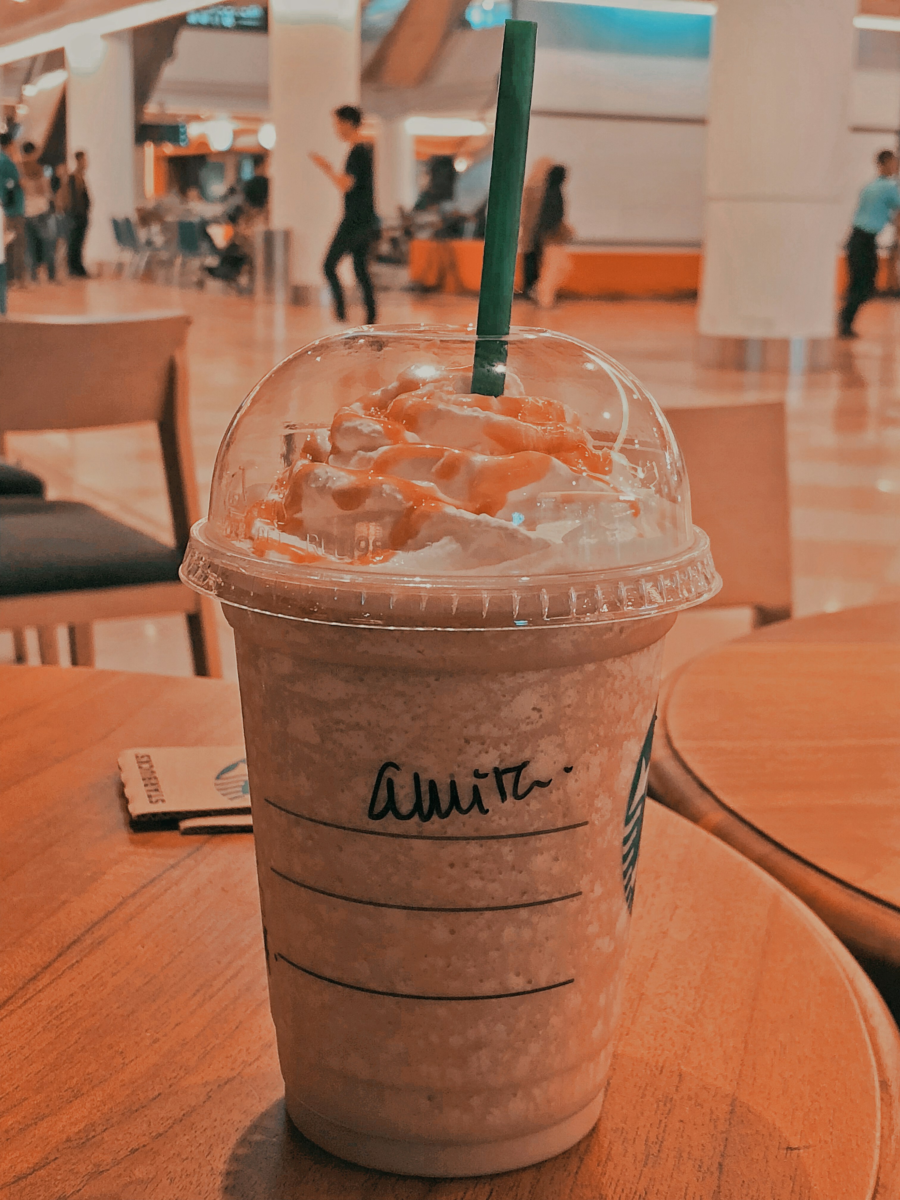 Velvet Sip cold coffee frappe with whipped cream and chocolate drizzle in clear cup