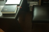 Close-up of legal scales and law books on a wooden desk