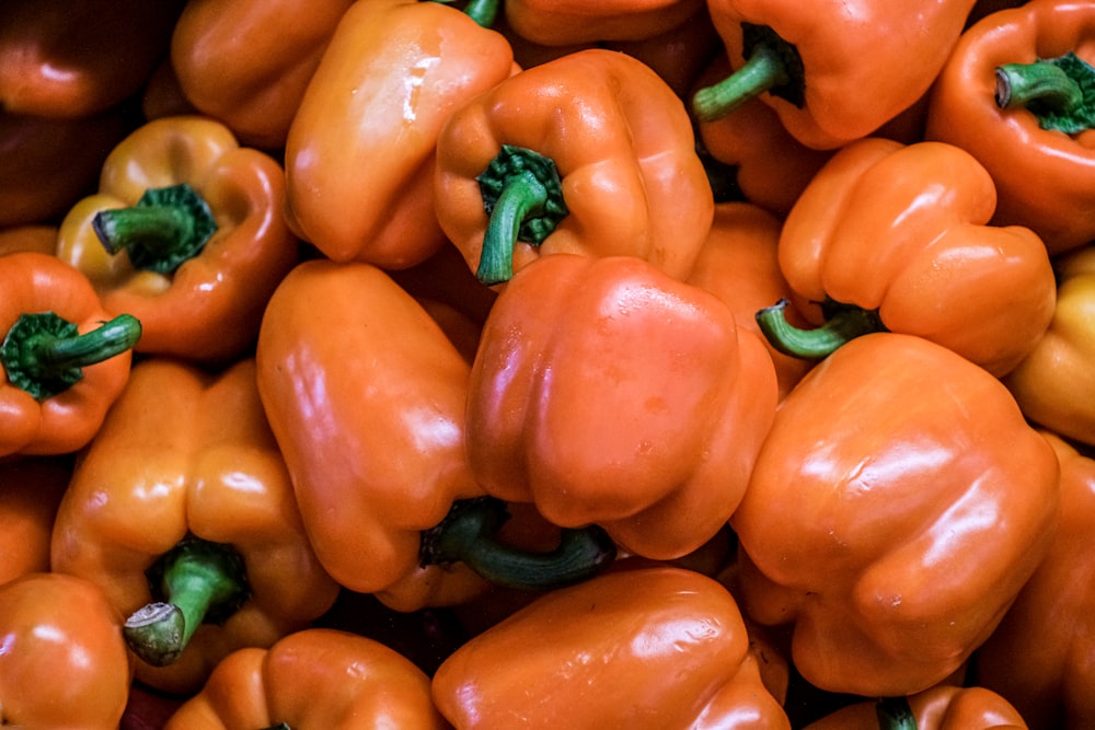 red bell pepper on brown wooden table