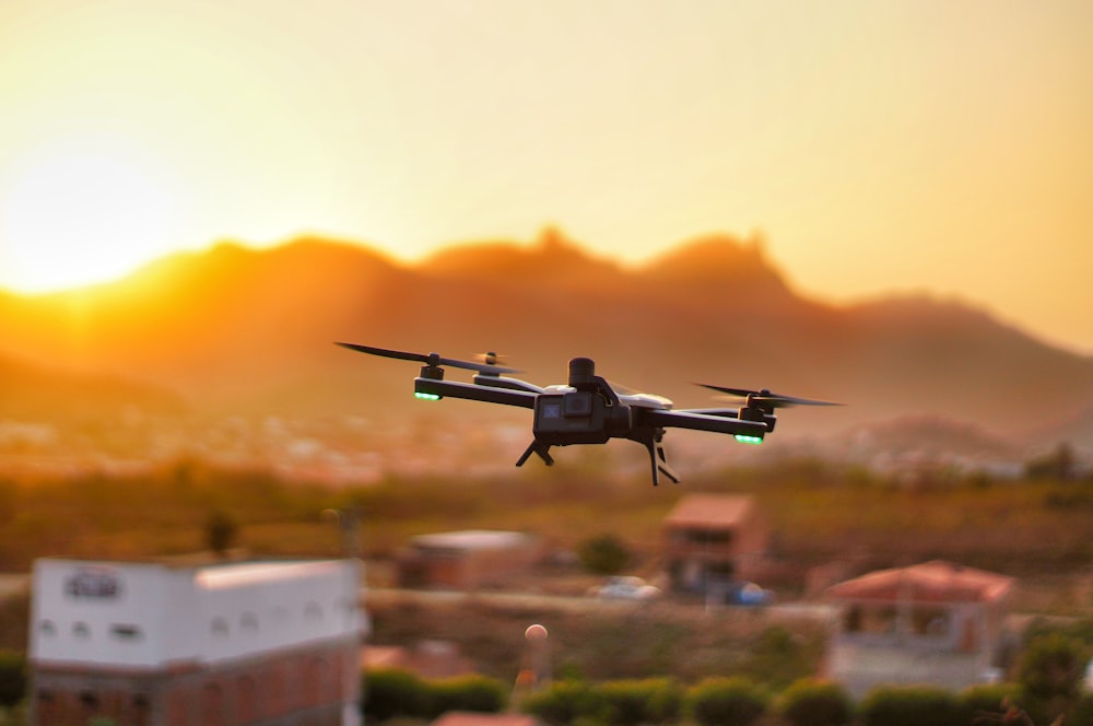 black and white drone flying during daytime