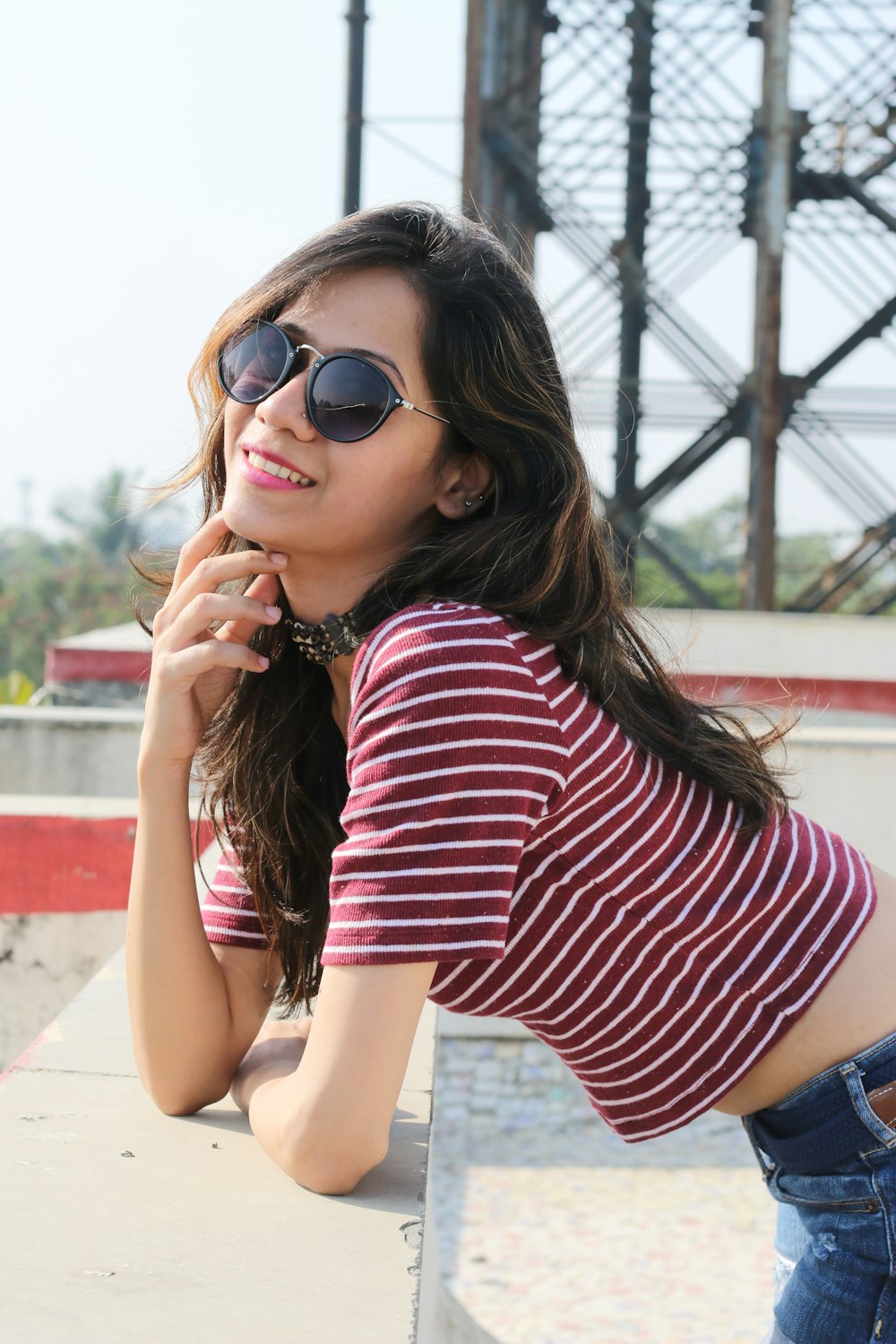 woman in red and white striped shirt wearing black sunglasses