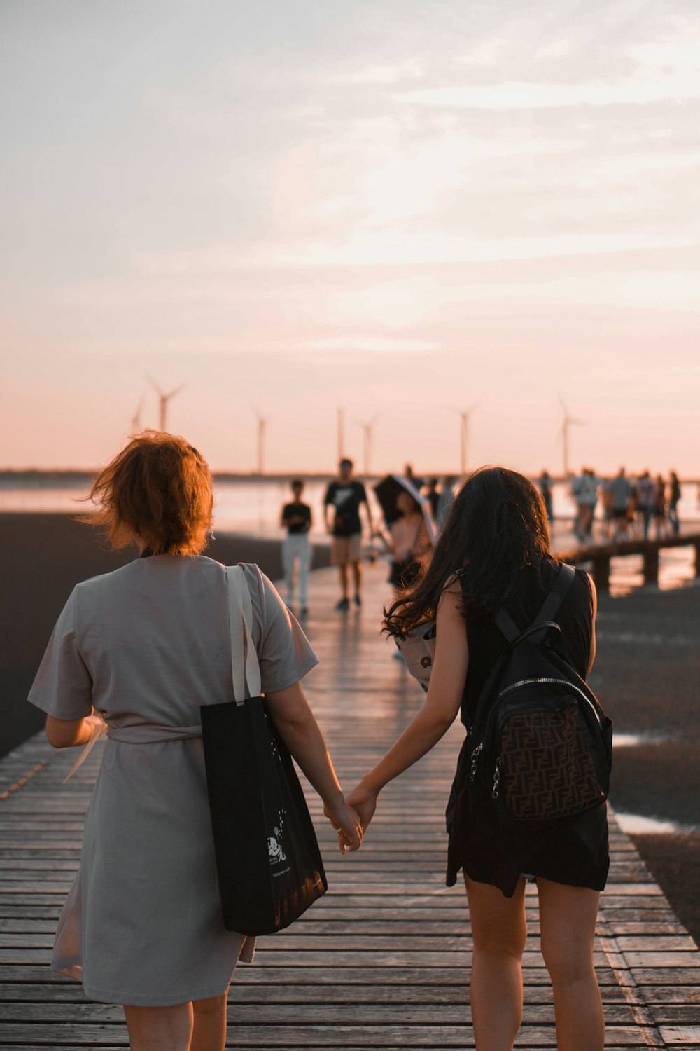 man and woman walking on the street during daytime