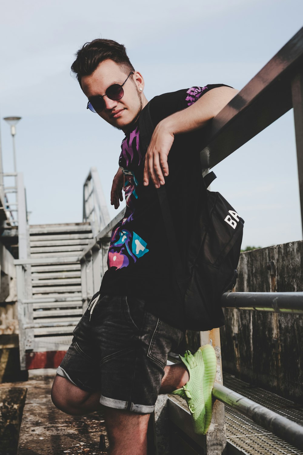 man in black t-shirt and black pants wearing black sunglasses