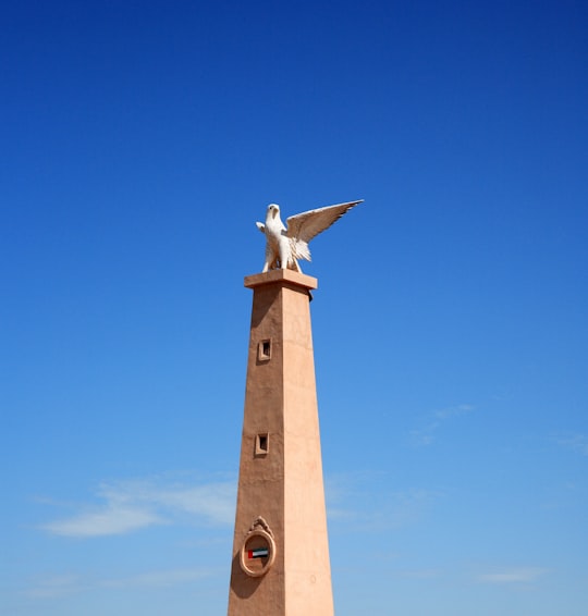 brown and white windmill under blue sky during daytime in Umm Al Quwain - United Arab Emirates United Arab Emirates