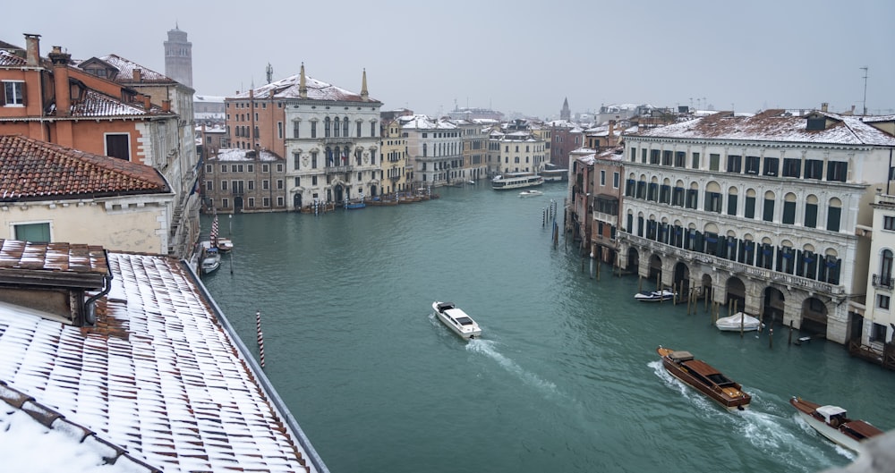 boat on water near buildings during daytime