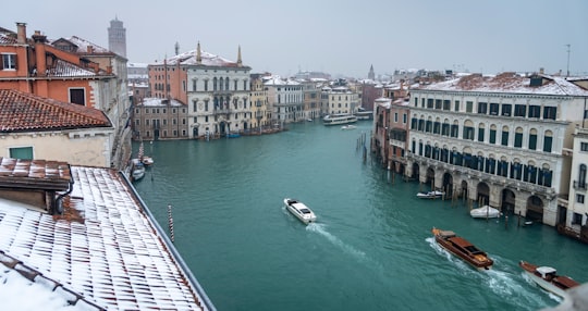 boat on water near buildings during daytime in Ca' Rezzonico Italy