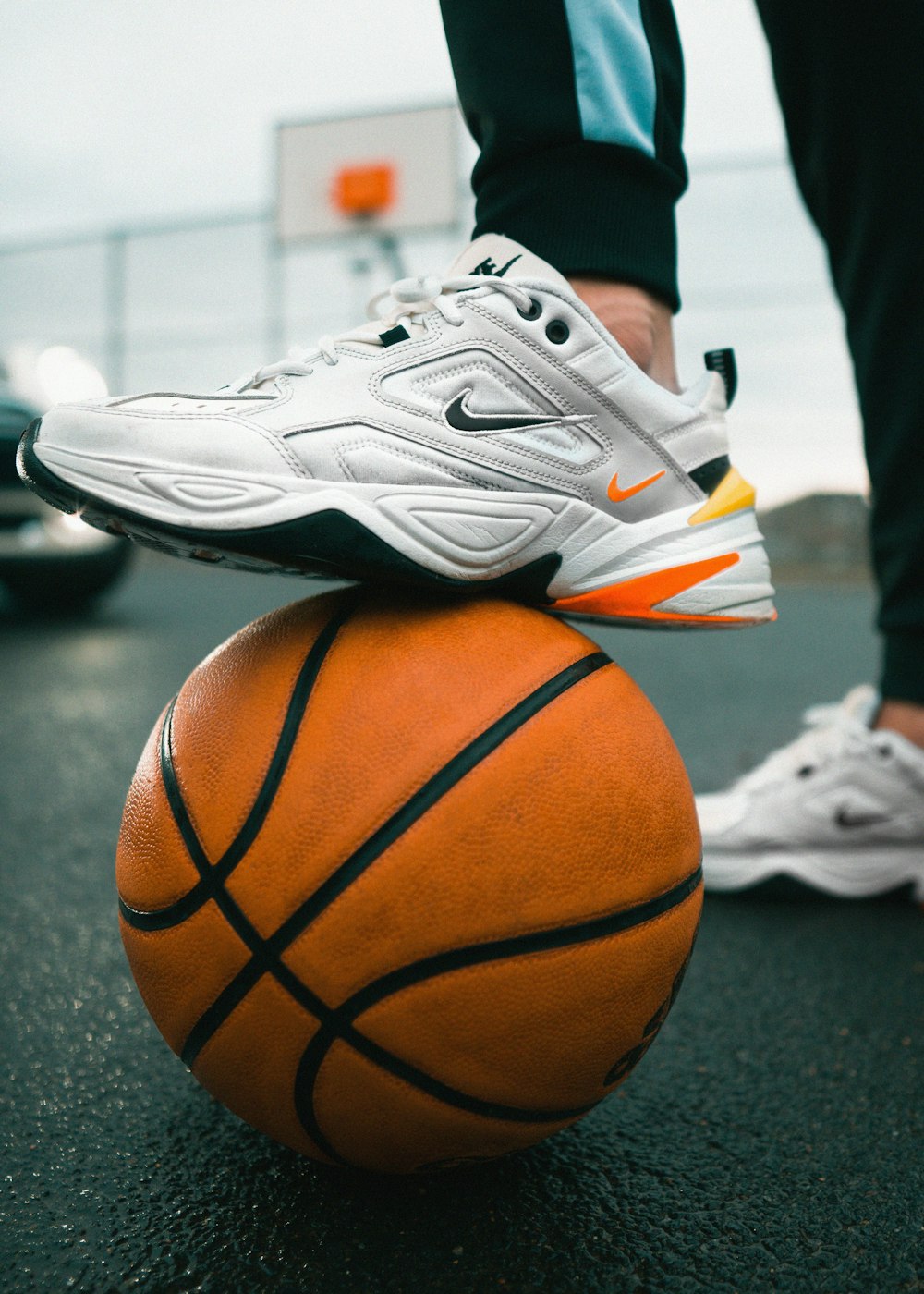 a person standing on top of a basketball