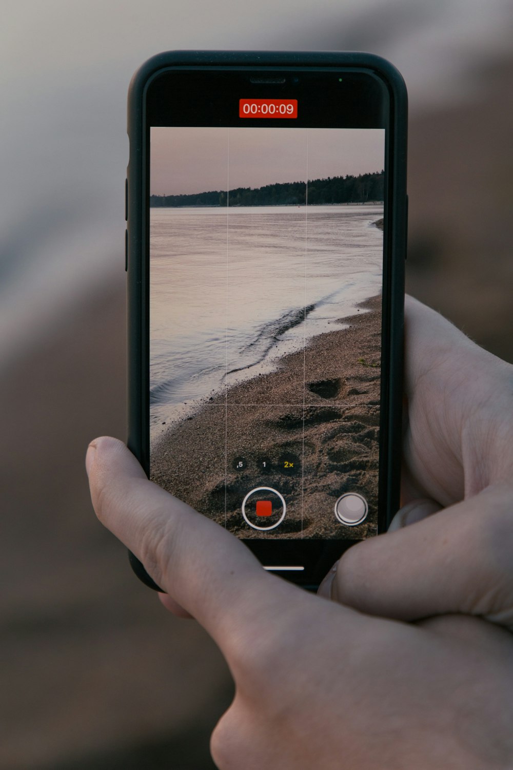 person holding black and white smartphone