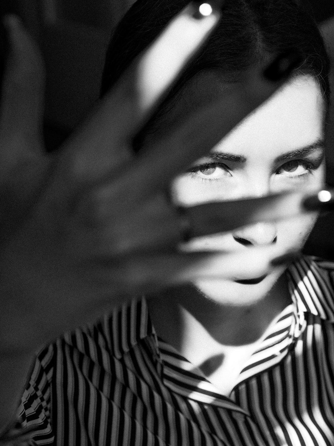 woman in black and white stripe shirt