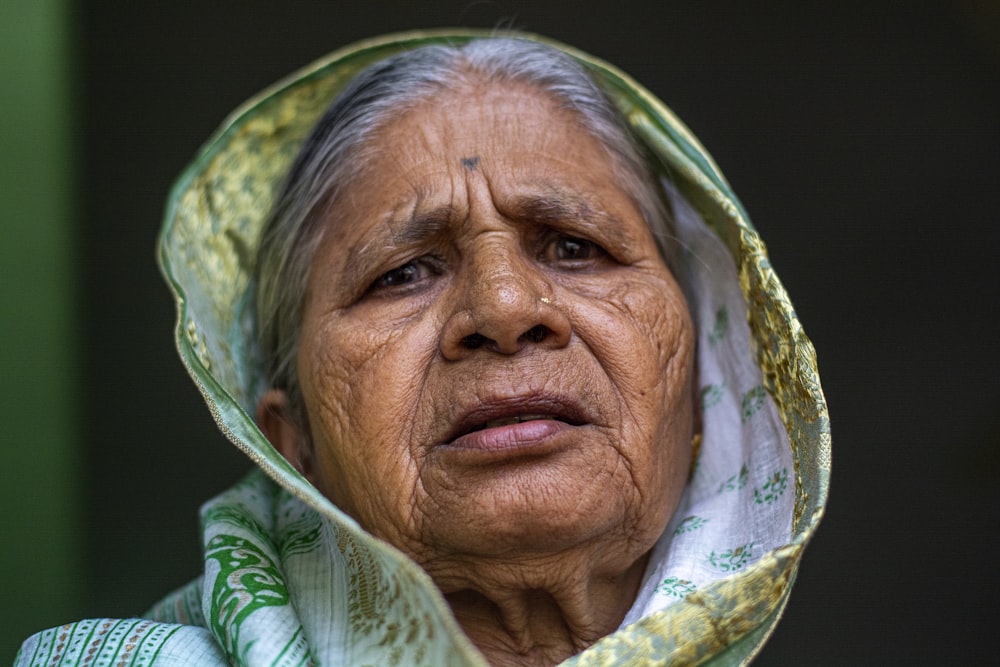 woman in green white and blue hijab