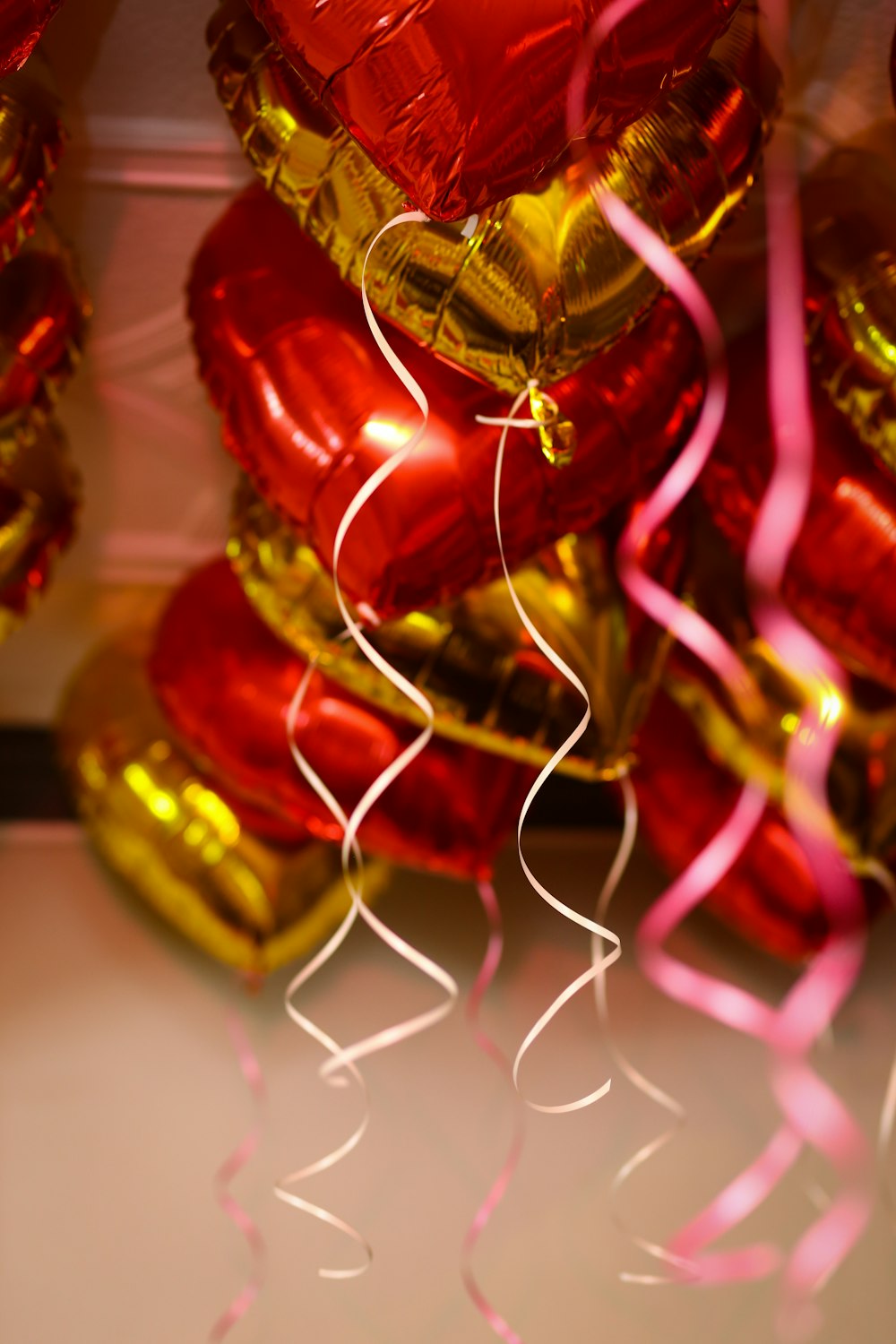 red and gold baubles on white surface