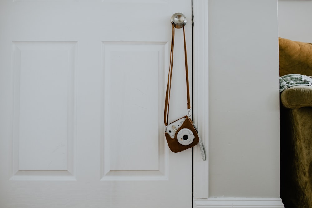 white wooden door with gold door lever