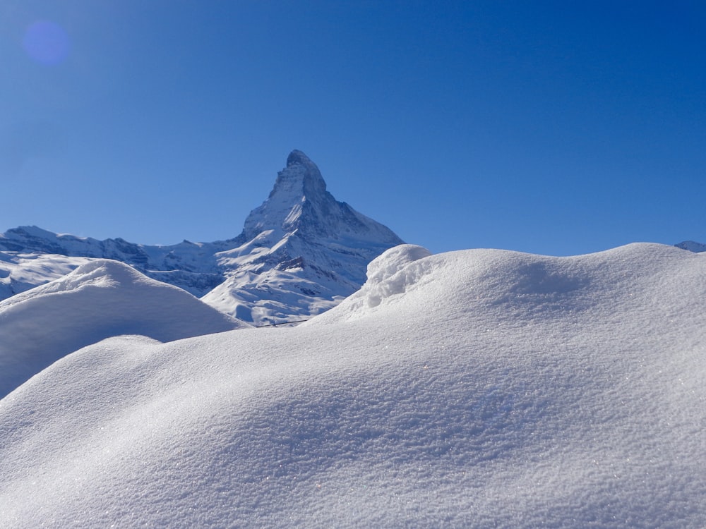 snow covered mountain under blue sky during daytime