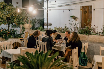 people sitting on chairs inside restaurant