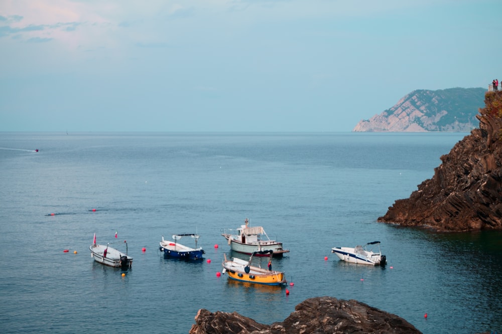 white and yellow boat on sea during daytime