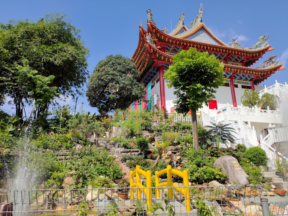 brown and white temple surrounded by green trees during daytime