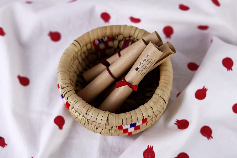 brown wooden sticks on brown woven round basket