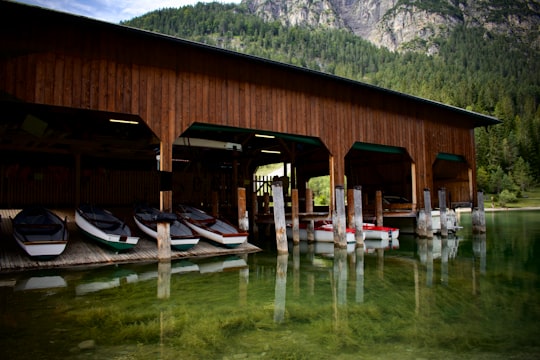 brown wooden house near lake and trees during daytime in Heiterwang-Plansee Austria