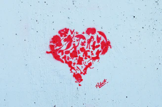 The Lucky Paws Animal Advocates logo featuring a paw print intertwined with a heart symbol.