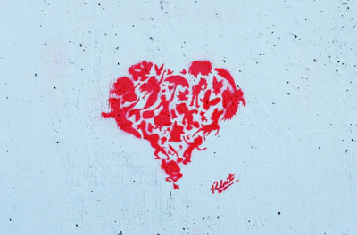 The Lucky Paws Animal Advocates logo featuring a paw print intertwined with a heart symbol.