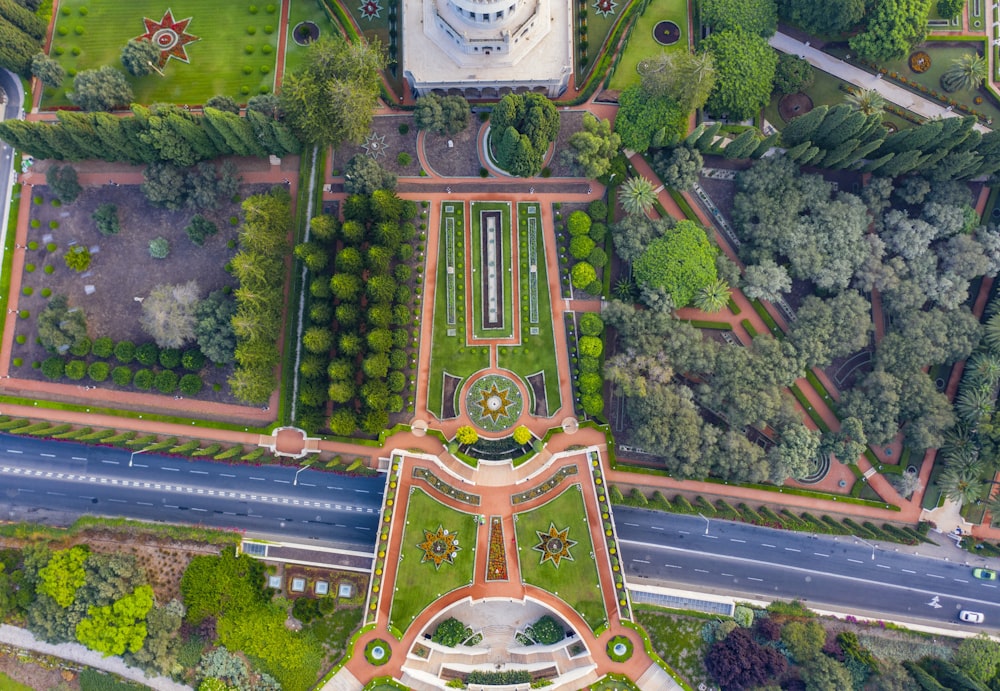 brown and green cross surrounded by green plants