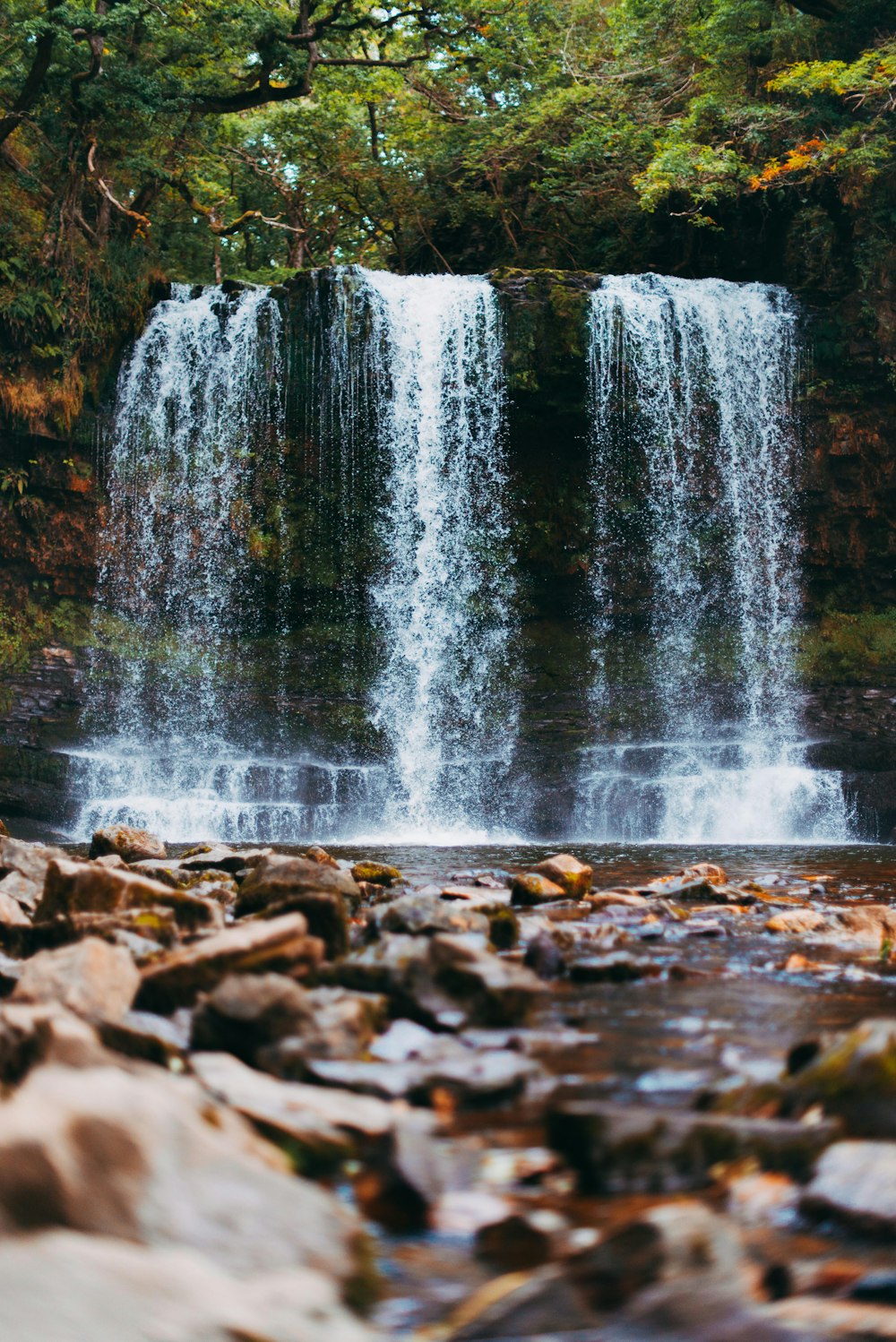 water falls on rocky ground