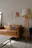 A cozy living room wall featuring a vivid art print from Saltloft Gallery, bathed in natural light.