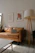 A cozy living room wall featuring a vivid art print from Saltloft Gallery, bathed in natural light.