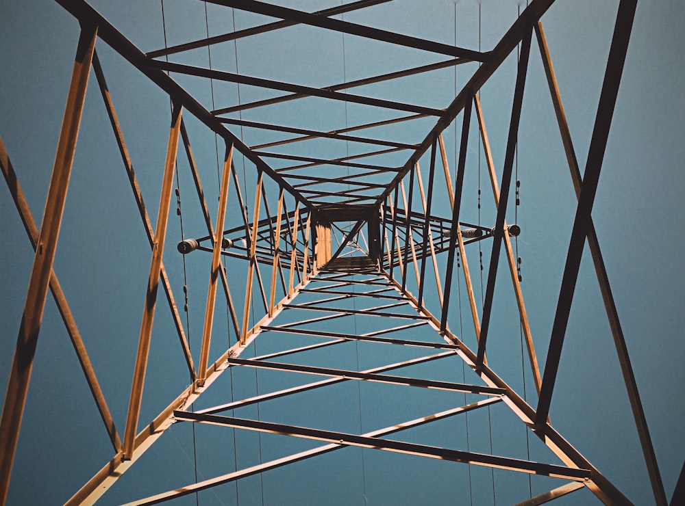 grey metal bridge under blue sky during daytime