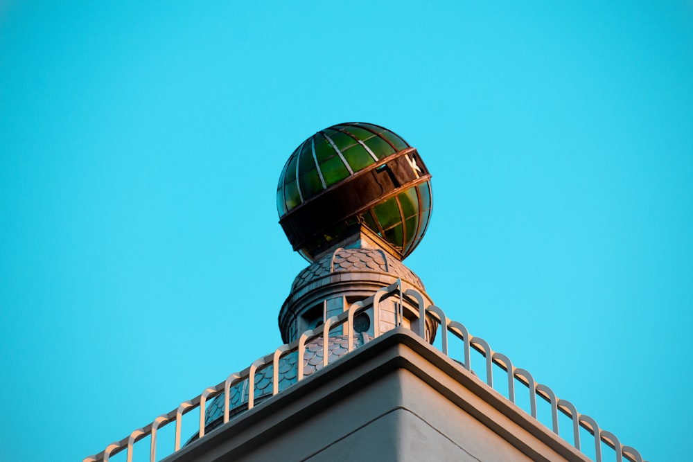 green and white concrete building under blue sky during daytime