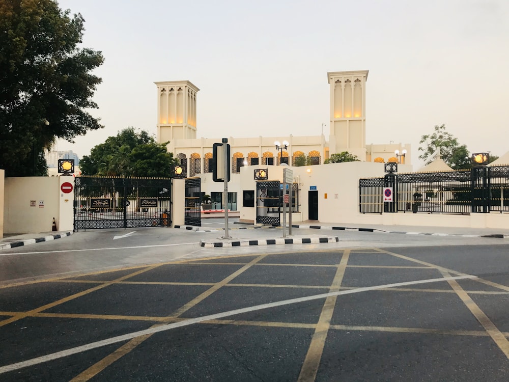 white concrete building near green trees during daytime