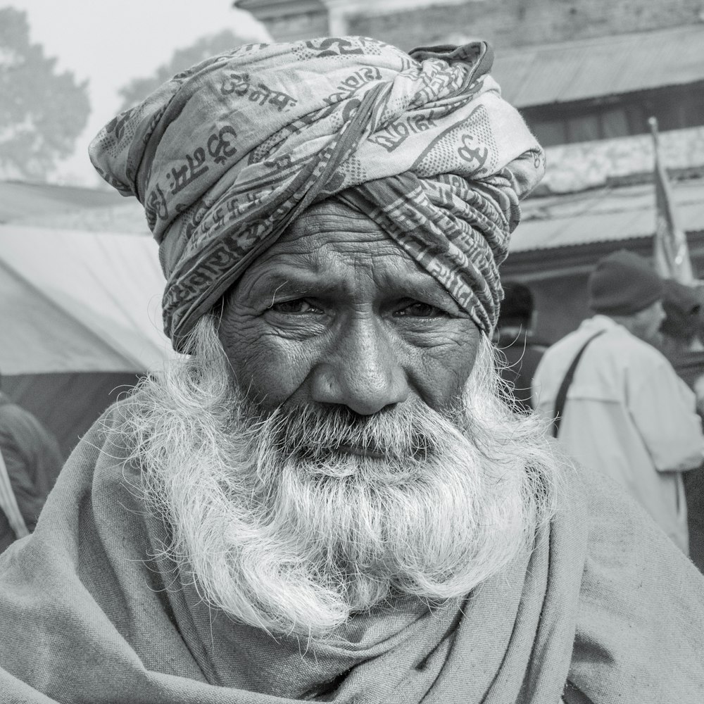 grayscale photo of man wearing bandana