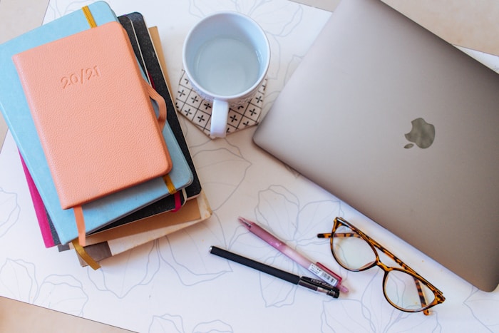 Mug beside a pen and paper on a desk