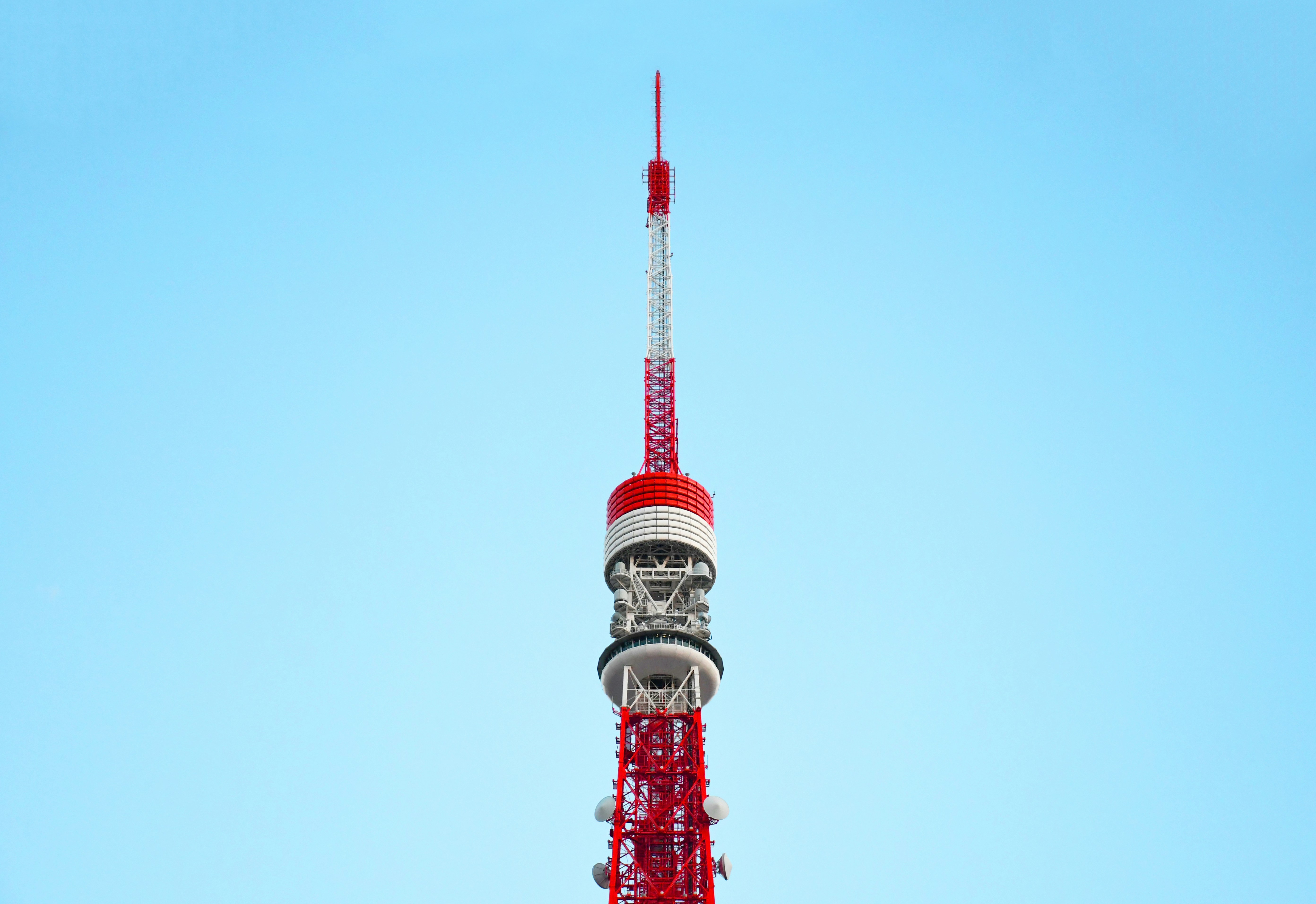 red and white tower under blue sky